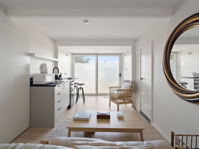 The open-plan layout creates a seamless flow from the kitchen to the living area.