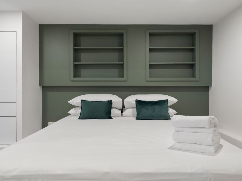 Sink into plush bedding after a day spent exploring the local area.