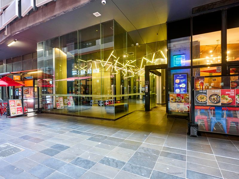 The building's vibrant entrance places you in the heart of the action.