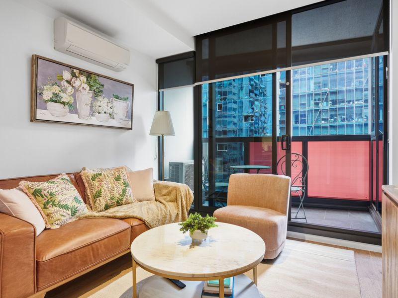 Unwind in the cosy lounge with floor-to-ceiling windows and city views.