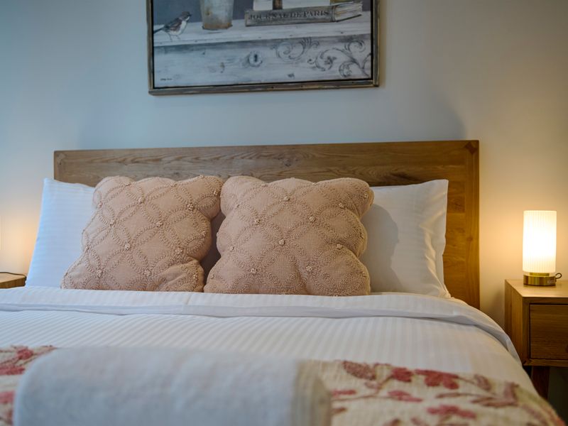 Plush bedding ensures a relaxing stay after a day of exploring.