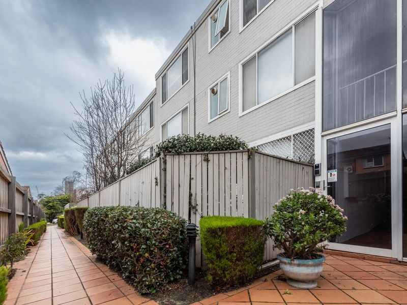 Exterior view of the apartment building and private entry.