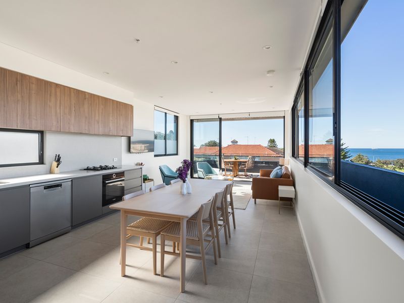 Cook with panoramic water views in the beautifully appointed gourmet kitchen.