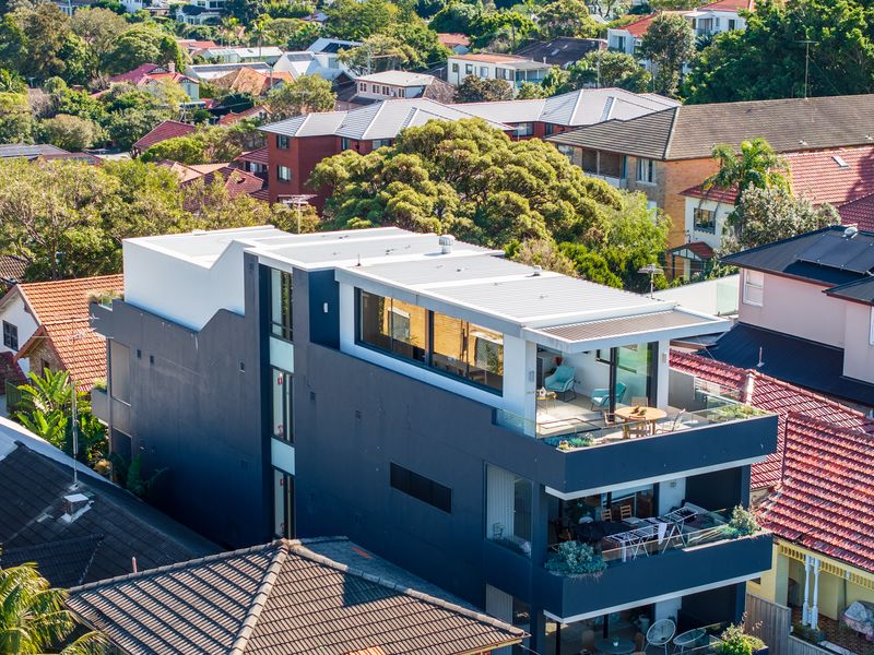 Take in the stunning aerial view of this contemporary coastal residence.