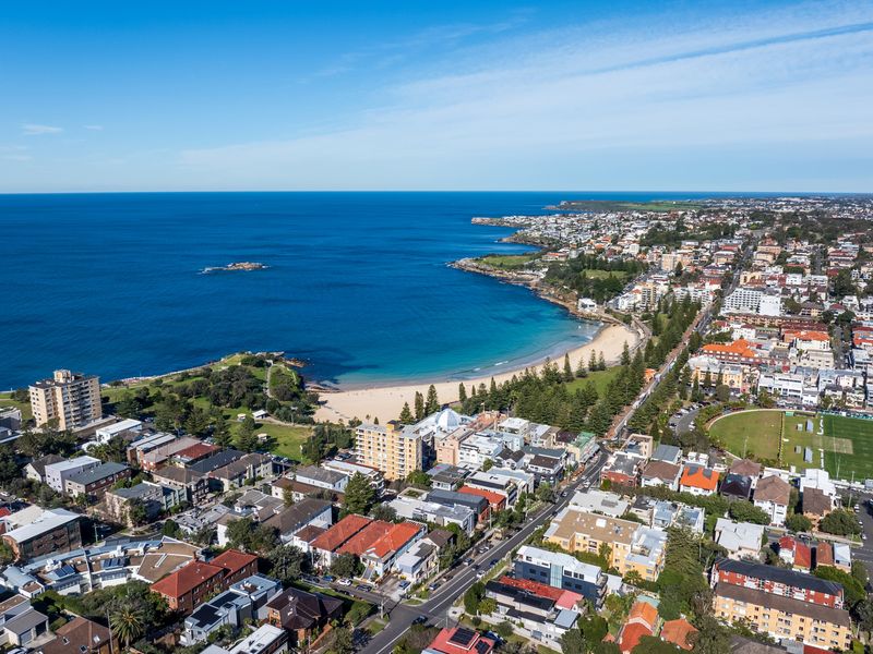 The coastline unfolds before you with stunning blue-water scenery.