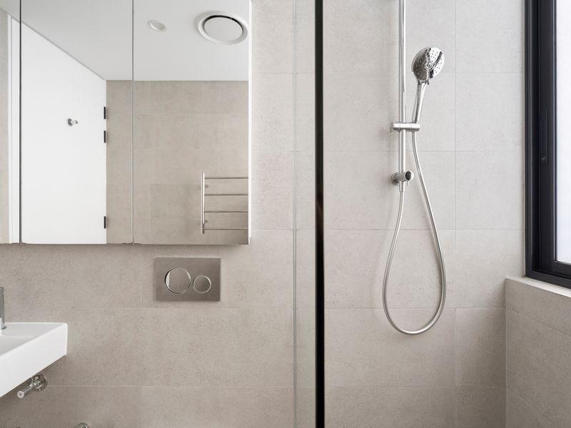 The minimalist bathroom design blends style with everyday comfort.