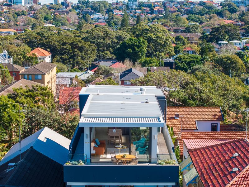 A bird's-eye perspective highlights the home's exceptional coastal setting.