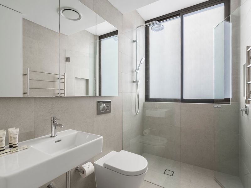 The modern bathroom features sleek finishes and a bright, contemporary design.