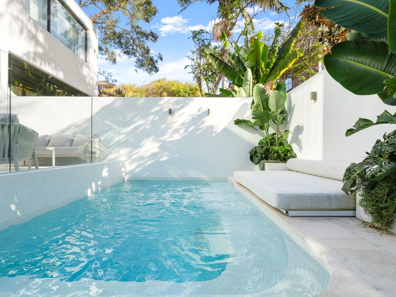 Refresh in the tranquil plunge pool surrounded by lush tropical landscaping.