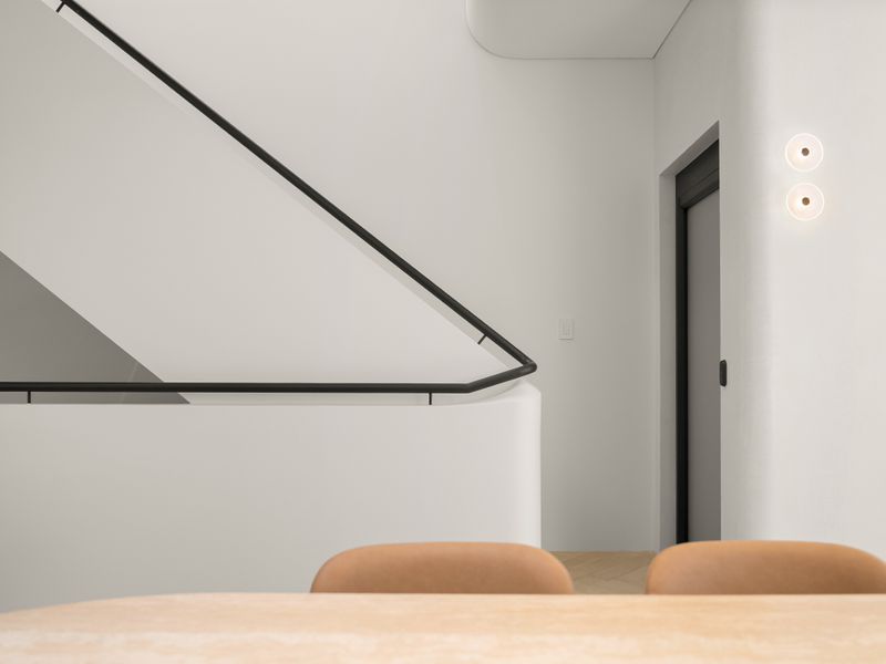 Contemporary staircase and hallway with clean architectural details.