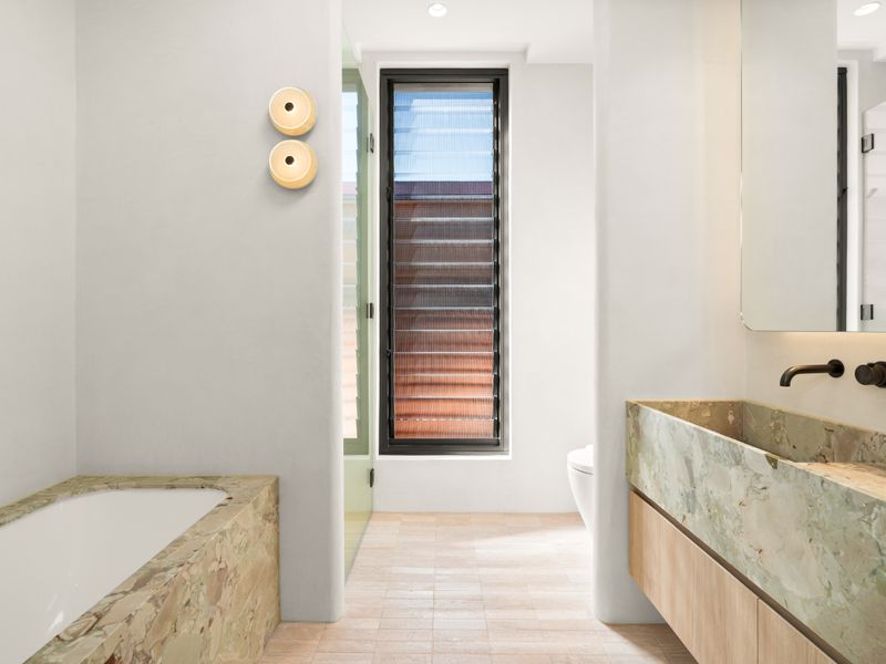 Luxurious bathroom featuring a deep soaking bathtub.