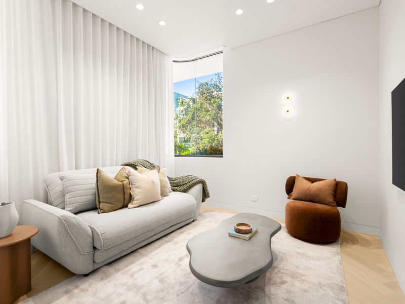 Light-filled sitting area overlooking the private courtyard.
