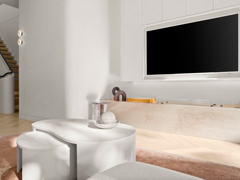 Relaxing media lounge with built-in TV and custom cabinetry.