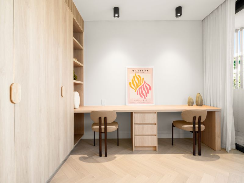 Dedicated workspace with custom desk and shelving.