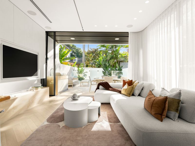 Bright living room opening effortlessly to the outdoor retreat.