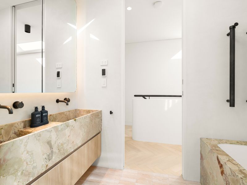 Vanity with premium stone finishes and modern fixtures.