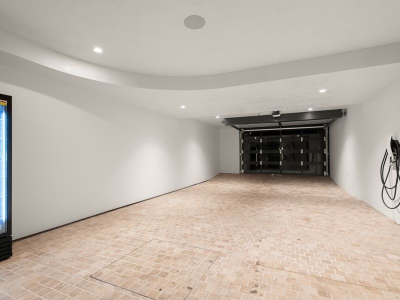 Secure double garage with ample space for parking and storage.