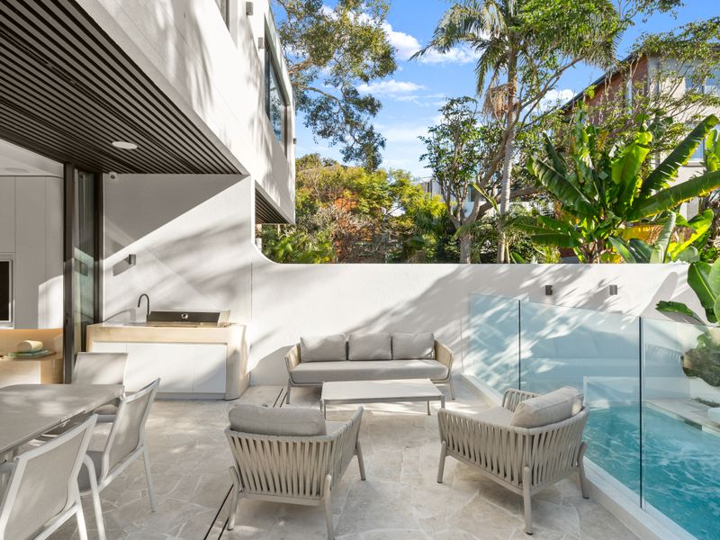 Private alfresco courtyard for outdoor dining and relaxation.