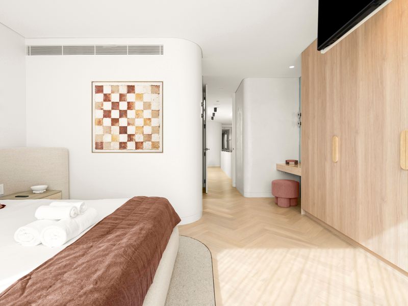 Bright and inviting bedroom designed for restful nights and lazy mornings.
