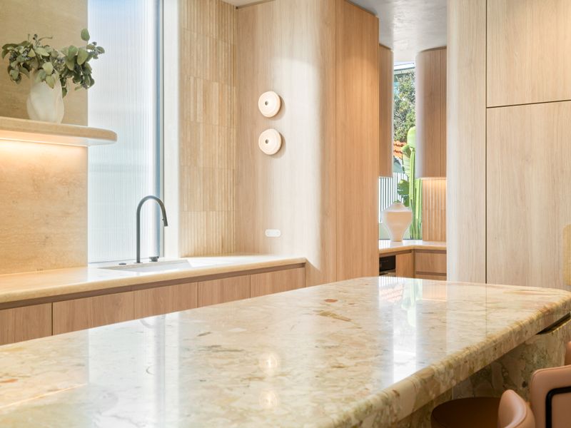 Gourmet kitchen with integrated appliances and abundant workspace.