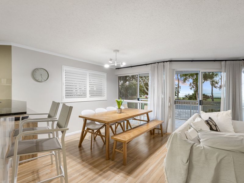 Light-filled dining area with outdoor views