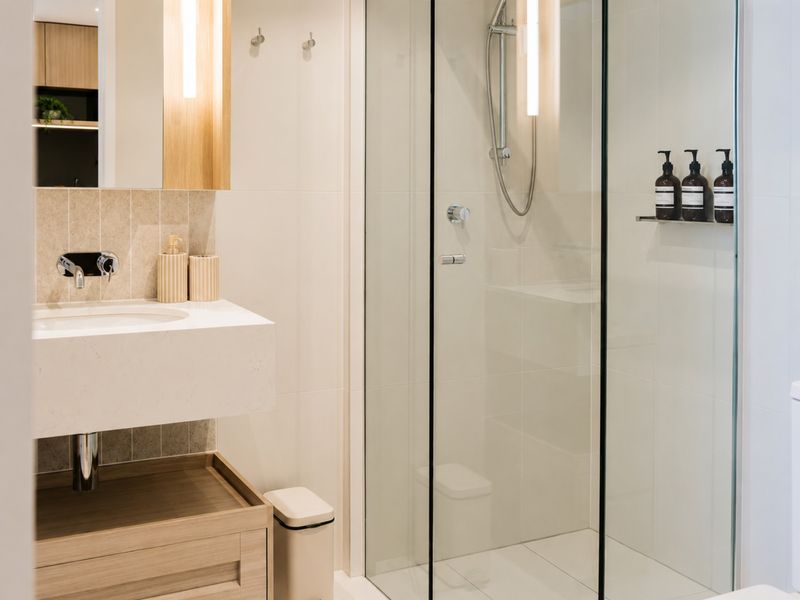 Contemporary bathroom with walk-in shower and sleek vanity.