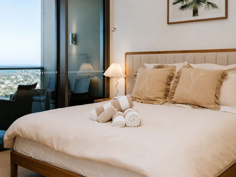 Wake up to stunning skyline views from your bed.