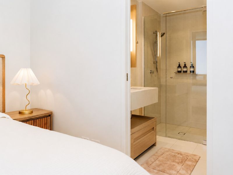 Ensuite bathroom conveniently connected to the bedroom.