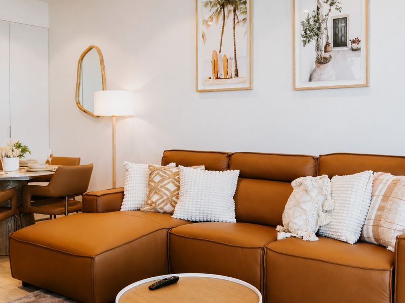 Comfortable leather sofa invites you to unwind after a busy day.