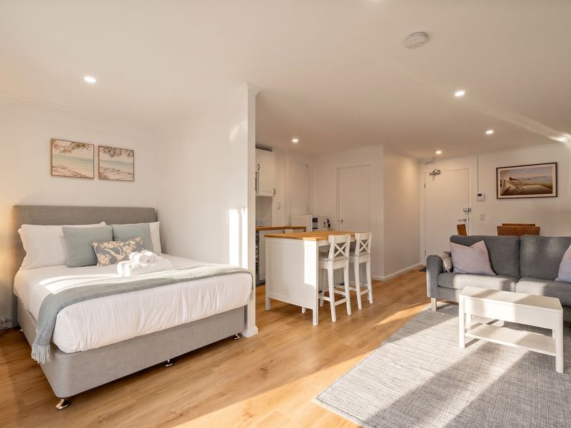 Sunlit studio with a welcoming atmosphere.
