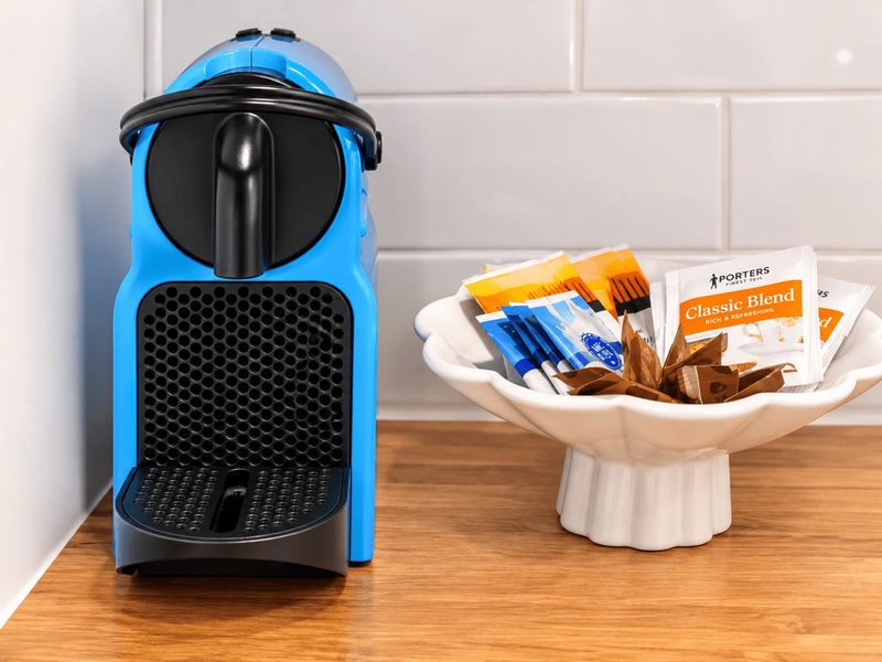 Pod coffee machine with complimentary tea, coffee and sugar provided for your stay.