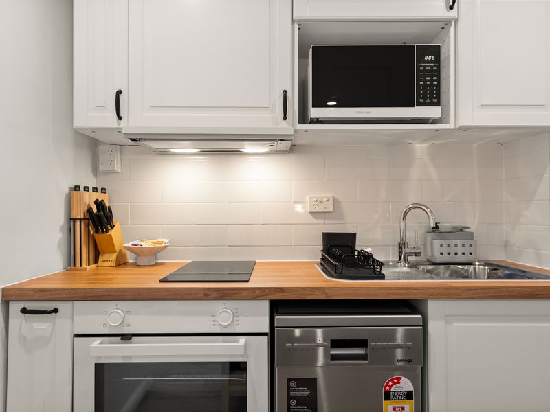 Compact kitchenette with everything needed for your stay.