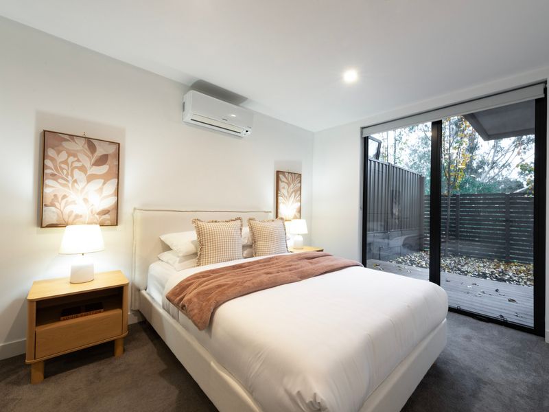 Spacious second master bedroom with private outdoor access.