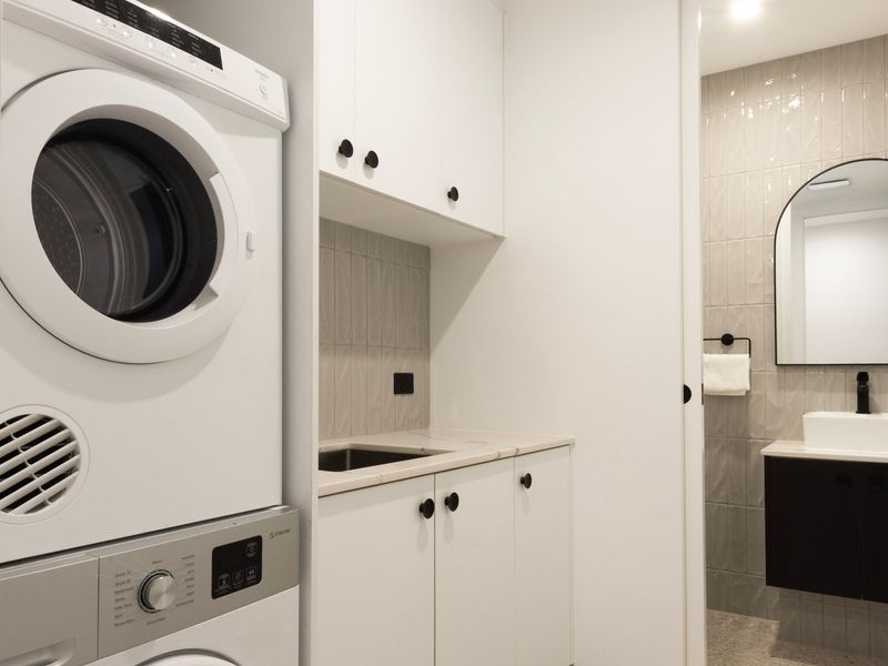 Internal laundry with washer and dryer for your convenience + powder room.