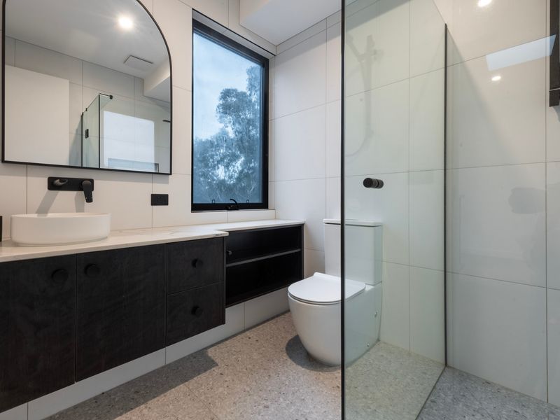 Modern main bathroom with generous vanity space.