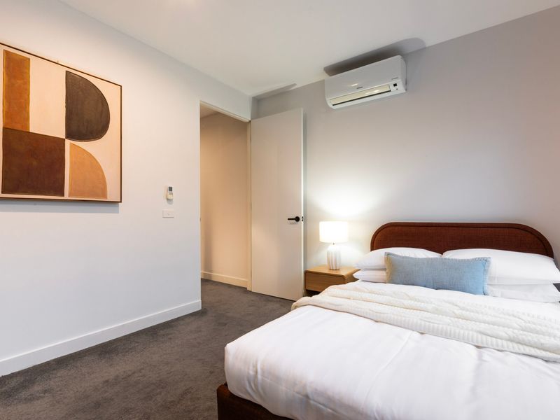 Comfortable double bedroom with split-system air conditioning.