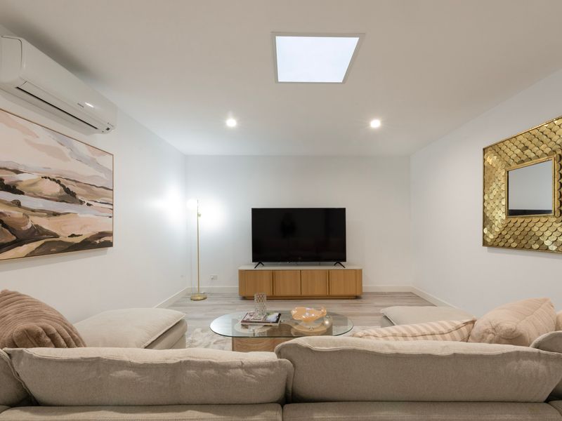 Spacious lounge with Smart TV and comfortable seating for the whole family