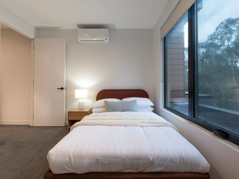 Wake up to peaceful treetop views from your bedroom.