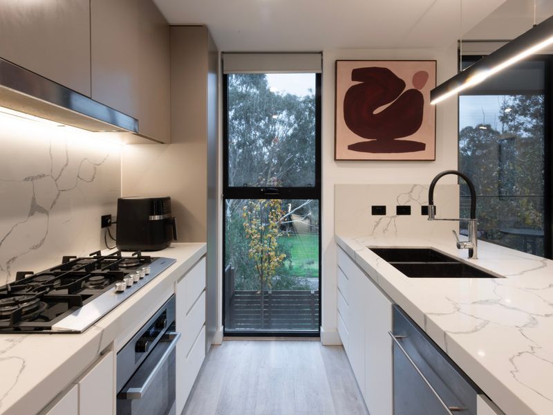Modern kitchen with quality appliances and plenty of bench space.