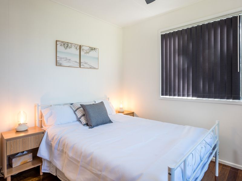 Comfortable guest bedroom with soft bedding and a relaxing atmosphere.
