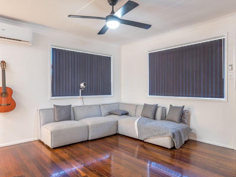 Relaxing lounge with comfortable sectional seating and guitars for added character.
