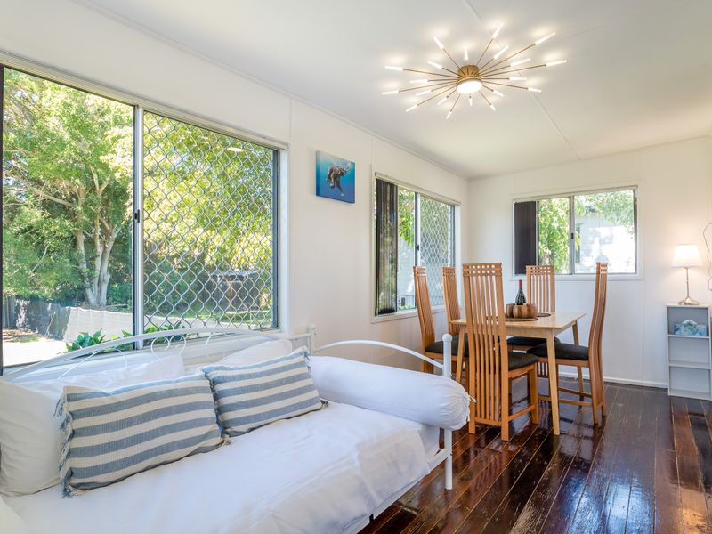 Flexible living and dining space with views across the garden.