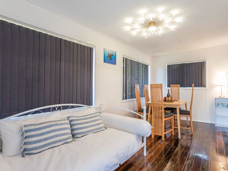 Bright living area with comfortable seating and a dining nook.