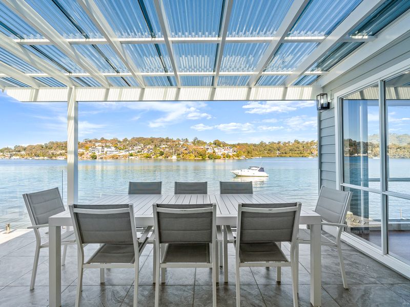 Outdoor dining overlooking the sparkling water