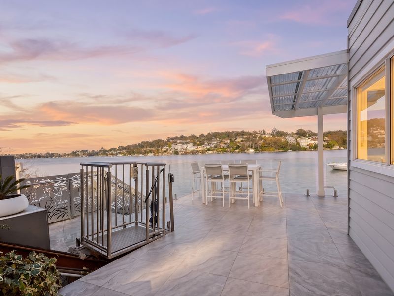 Twilight settles over the bay and waterfront retreat