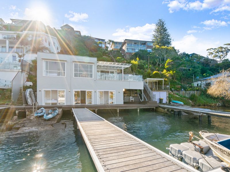 A beautiful home nestled along the shoreline