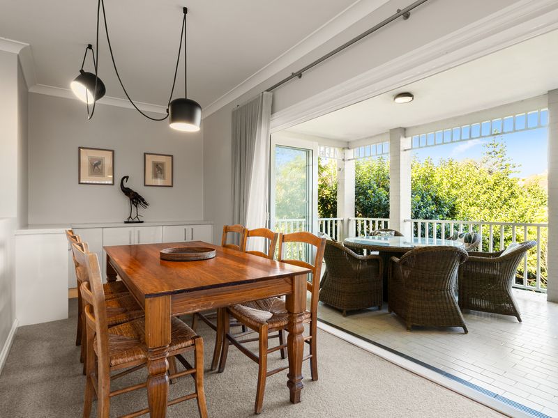 Open dining area flowing seamlessly to the outdoor balcony.