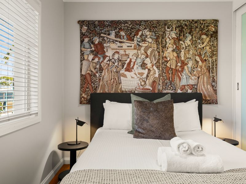 Wake up to peaceful views from the stylish main bedroom.