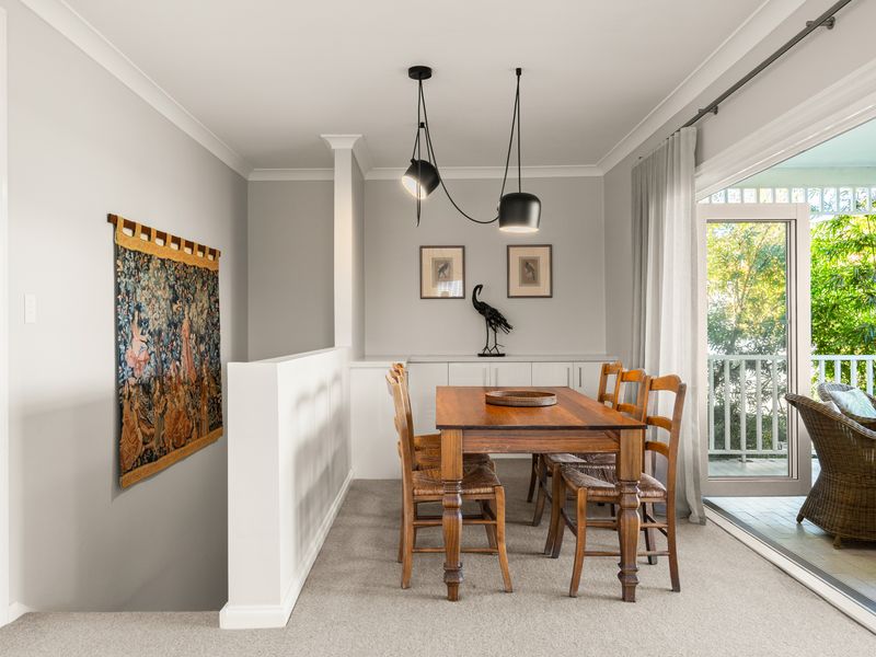 Bright dining area opening directly onto the balcony.