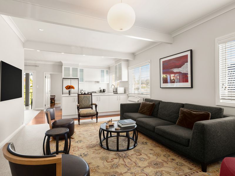 Spacious open-plan living area with comfortable lounge seating.